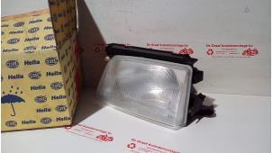 Gebruikte Koplamp links Opel Kadett E (33/34/43/44) Prijs € 50,00 Margeregeling aangeboden door de Graaf autodemontage B.V.