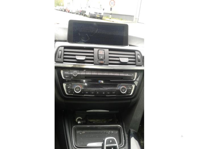 Radio CD Speler van een BMW 4 serie (F33) 428i xDrive 2.0 Turbo 16V 2015