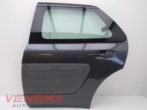 Gebruikte Deur 4Deurs links-achter Citroen C4 Cactus (0B/0P) 1.2 PureTech 82 12V Prijs € 249,99 Margeregeling aangeboden door Venema Autoparts