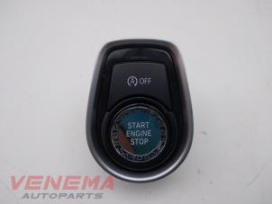 Gebruikte Start/Stop schakelaar BMW 1 serie (F20) 116d 1.5 12V TwinPower Prijs € 14,99 Margeregeling aangeboden door Venema Autoparts