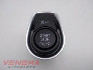 Gebruikte Start/Stop schakelaar BMW 1 serie (F20) 116i 1.5 12V Prijs € 14,99 Margeregeling aangeboden door Venema Autoparts