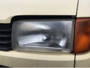 Gebruikte Koplamp links Volkswagen Transporter Prijs op aanvraag aangeboden door N Kossen Autorecycling BV