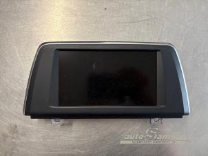 Gebruikte Display Multi Media regelunit BMW 2 serie Gran Tourer (F46) 218i 1.5 TwinPower Turbo 12V Prijs € 400,00 Margeregeling aangeboden door Auto Samsen B.V.