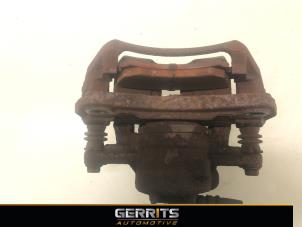 Gebruikte Remklauw (Tang) links-voor Mitsubishi Colt (Z2/Z3) 1.3 16V Prijs € 19,99 Margeregeling aangeboden door Gerrits Automotive BV