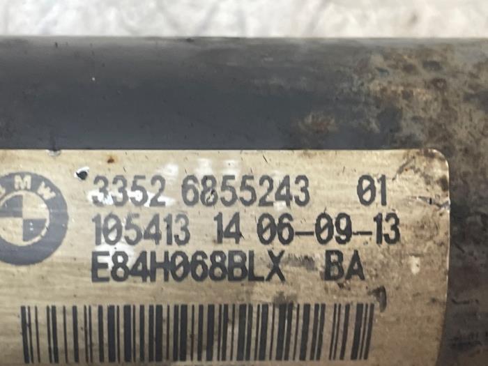 Schokdemper links-achter van een BMW X1 (E84) xDrive 18d 2.0 16V 2013