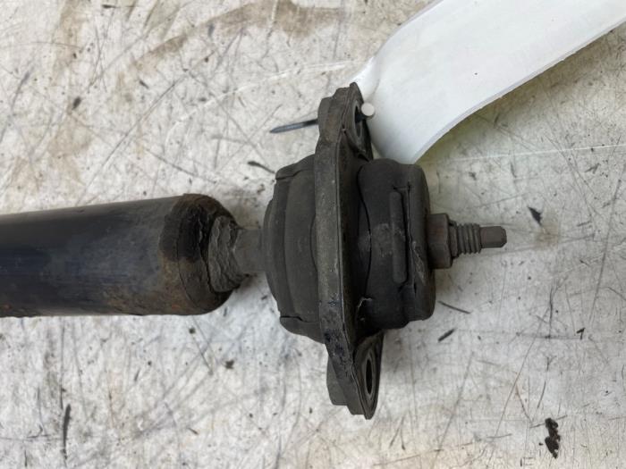 Schokdemper links-achter van een BMW X1 (E84) xDrive 18d 2.0 16V 2013