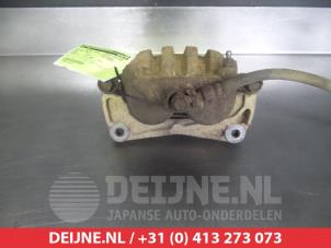 Subaru Impreza Bremszange links vorne O324967 foto 2