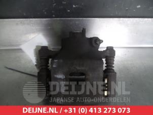 Nissan Pixo Remklauw (Tang) links-voor O324827 foto 2