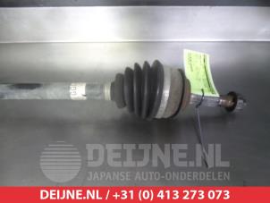Toyota Yaris Aandrijfas rechts-voor O320134 foto 2
