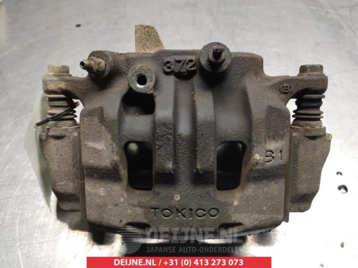 Mitsubishi L200 Remklauw (Tang) links-voor O325237