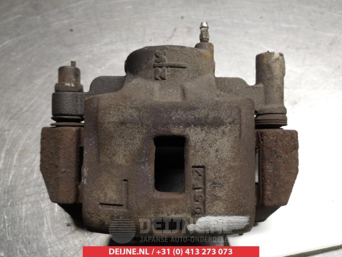 Mazda 323F Bremszange links vorne O324572