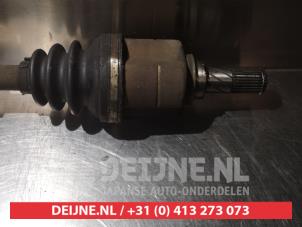 Nissan Almera Aandrijfas links-voor O317763 foto 3