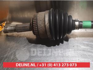 Nissan Almera Aandrijfas links-voor O317764 foto 2