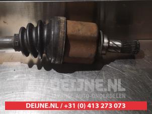 Nissan Almera Aandrijfas links-voor O317764 foto 3