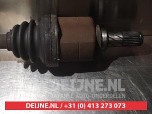 Nissan Almera Aandrijfas links-voor O317765 foto 3
