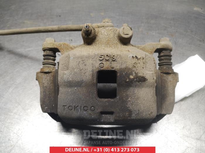 Mitsubishi L200 Bremszange links vorne O325275