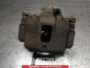Kia Carens Bremszange links vorne O325012 foto 2