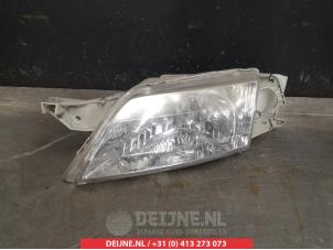 Mazda Premacy Koplamp links O266371 foto 2