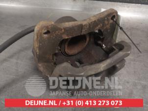 Toyota Celica Bremszange links vorne O325686 foto 2