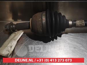 Nissan Micra Aandrijfas links-voor O317737 foto 2