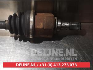 Nissan Micra Aandrijfas links-voor O317737 foto 3