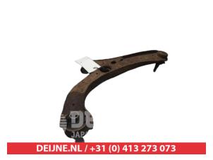 Daihatsu Cuore Front lower wishbone, left O381645 foto 2