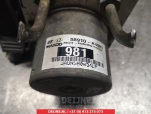 Kia Carens ABS Pomp O337788 foto 2