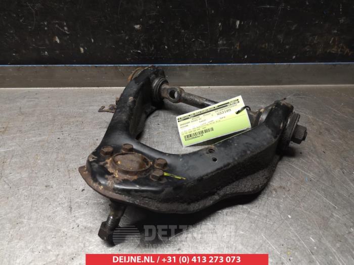 Nissan Terrano Draagarm boven rechts-voor O380812