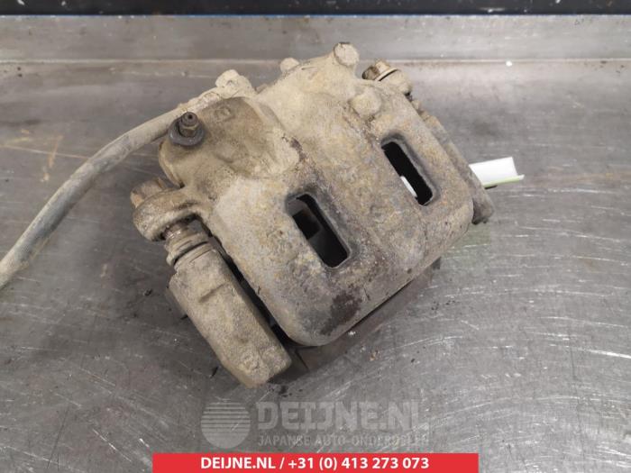 Mitsubishi Pajero Front brake calliper, left O325219