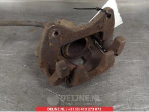 Daihatsu Cuore Bremszange links vorne O325396 foto 2