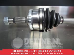 Nissan Primera Aandrijfas links-voor O9990005229 foto 2