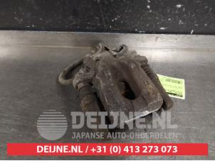 Toyota Urban Cruiser Rear brake calliper, left O394658 photo 2