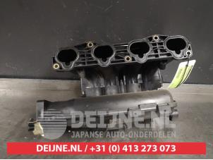 Nissan Primera Inlaatspruitstuk O403093 foto 3