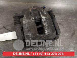 Nissan Micra Bremszange links vorne O404465 foto 2