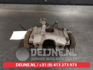 Toyota Yaris Bremszange rechts hinten O412704 foto 2