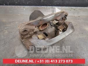 Subaru Legacy Bremszange links hinten O433633 foto 2