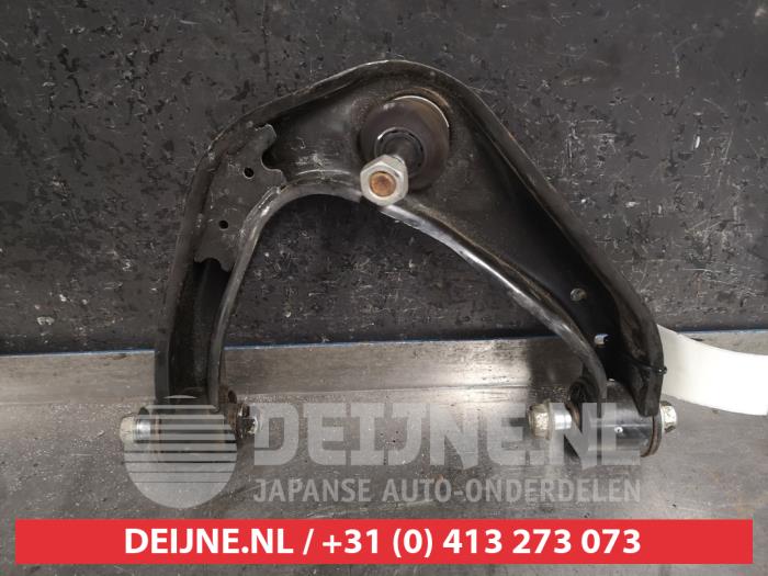 Nissan Navara Draagarm Boven links-voor O439151