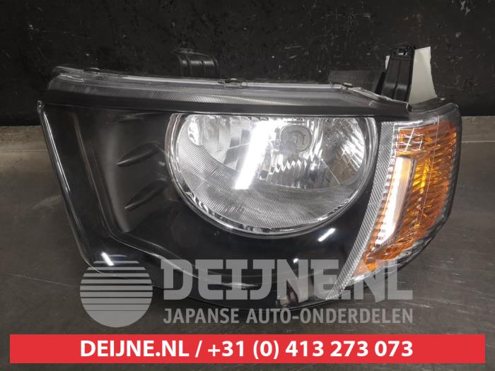 Mitsubishi L200 Koplamp links O443312