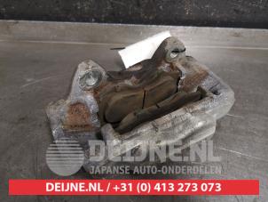 Toyota Hilux Front brake calliper, left O443804 photo 2