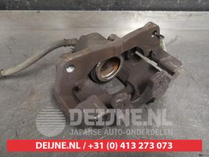 Toyota Yaris Bremszange links vorne O446727 foto 2