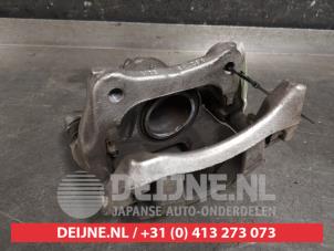 Nissan Micra Bremszange links vorne O452682 foto 2