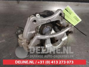 Toyota Corolla Bremszange links hinten O460836 foto 2