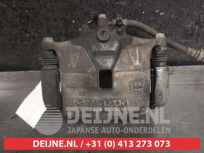 Mazda 3 Remklauw (Tang) links-voor O463167