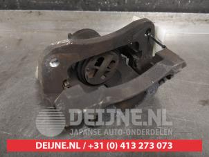 Suzuki Ignis Front brake calliper, left O467493 photo 2