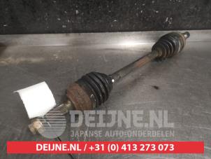 Daihatsu Cuore Aandrijfas links-voor O476302 foto 2