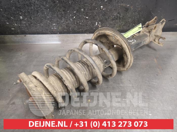Hyundai Coupe Schokdemperpoot links-achter O477322