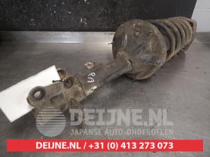 Hyundai Coupe Schokdemperpoot rechts-achter O477323 foto 2