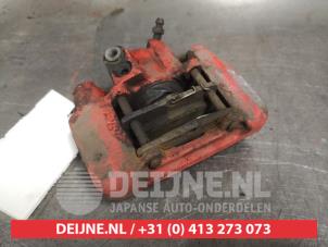 Toyota Celica Bremszange links hinten O477554 foto 2