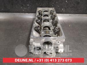 Cilinderkop van een Kia Shuma 1.5i 16V 2002