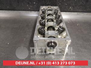 Cilinderkop van een Kia Shuma 1.5i 16V 2002
